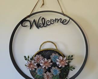 Metal Floral "Welcome" Wall Hanging - A charming and inviting touch for an entryway or front porch.
