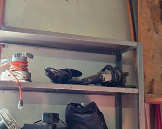 Includes a detail sander, belt sander, and angle grinder stored on a metal shelf. Ideal for restoration projects or adding reliable tools to your workshop collection.