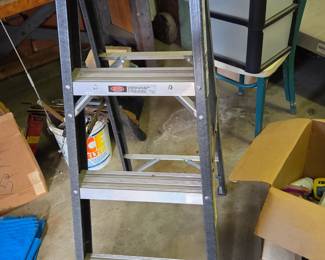 Werner 4-Step Fiberglass Ladder - Durable and lightweight with slip-resistant steps and a sturdy top tray. Ideal for indoor or garage use where extra height and stability are needed.