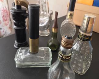 A unique mix of glass bottles, aftershave containers, and vintage-style applicators—great for collectors, up-cyclers, or as decorative curios.