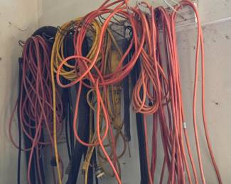 Large bundle of heavy-duty extension cords in various lengths and colors, along with power strips. Perfect for workshop setups, outdoor tools, or extra reach around the house.