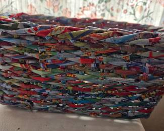 Colorful Handwoven Paper Basket – Crafted from rolled and woven recycled paper, this vibrant basket adds an eco-friendly pop of color to any room, perfect for storage or decorative display.