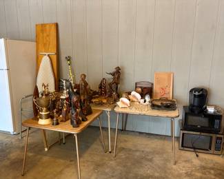 carved art from the Philippines and vintage trophies 