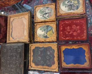 collection of antique daguerreotype and ambrotype cases, along with some of the images they would contain. $150.00 lot