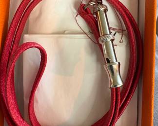 Hermes dog whistle on leather cord/nib