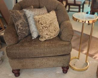 Stationary Sitting Chair. Brass Side Table.