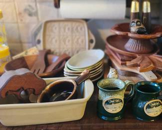 Vintage Sunflower Cannisters, Stoneware Mixing Bowl. Shortbread Pan, Stone Loaf Pan. Wooden Cutting Boards, Bowls, Decorative Elements.