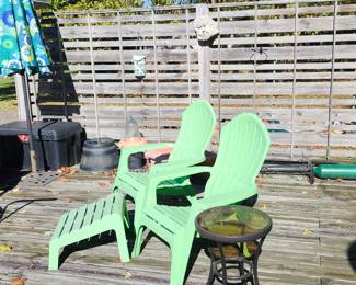 Resin Adirondack Chairs and Foot Rest. Patio side tables X2. Umbrella, Planters, Tuff Box. Decorative Garden Elements.