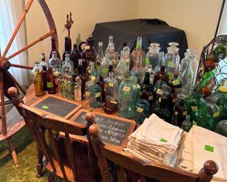 Large amount of bottles, school chalk boards, sugar sacks and grain sacks