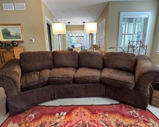 Four-Seat Curved Sofa. Measures Four-Seat Curve-Back Sofa with Down-Filled Cushions. Would be an amazing recovered. Measures 124" W x 36" D. Ask us for resources! Photo 1 of 4.