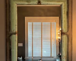 Metal Mirror with Patina. Measures 40" x 45" H. Photo 1 of 2.