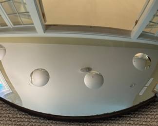 Convex Mirror In The Style of Fornasetti. Measures 18" D. Photo 2 of 2.