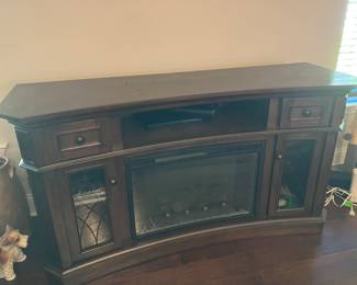 10 300.00 TV cabinet with built in fireplace 60Wx20Dx33H