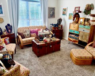 TROPICAL ROOM WITH LOTS OF CUBAN ART, RATTAN, DALLAS ANTIQUE STEAMER TRUNK.