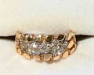14k gold ring with diamond chips.