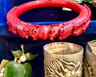 cinnabar dragon cuff, jade brooch, and antique c1850s antique Chinese silver dragon beakers.