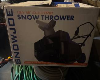 Basically new SnowJoe Snow Thrower- tested it and it works.  We have a cord so you can try it out as well.
