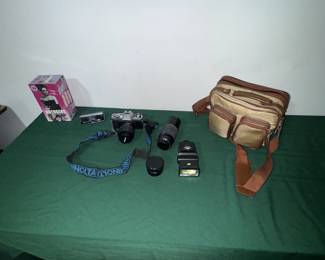 SLR Minolta Camera, lenses, flashes, and cases two cases.