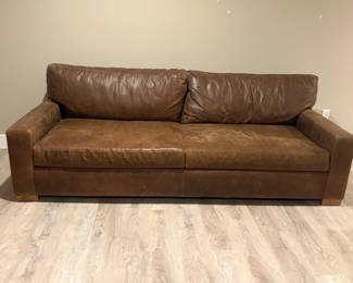 Restoration Hardware Maxwell Sofa (two available) upholstered in a distressed brown leather.
