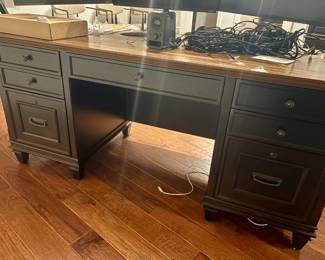 Front image of black wood desk. 