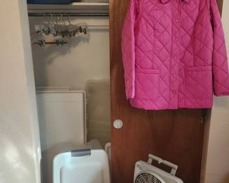 storage containers, pink puffy coat, cedar chest