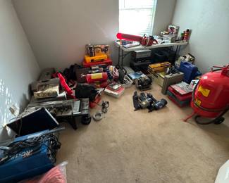 The tool room has saw, welding equipment, jacks, air compressors, chain saw and so much more.