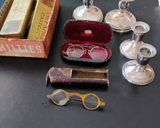 Turn of the century tortoise shell eye glasses, sterling marked candle holders
