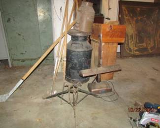 Milk can, hockey sticks, tree stand, desk light