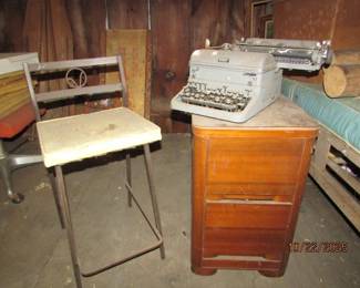 wooden file cabinet, metal chair, Royal typewriter