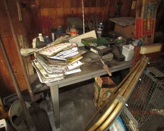 more license plates, animal trap, work table, RCBS ammunition loading machine