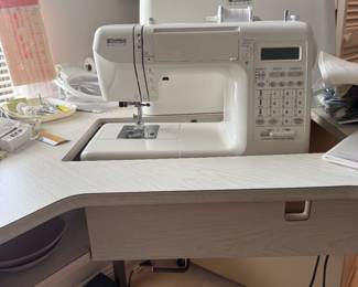 Very nice Kenmore computerized sewing machine with a great work table