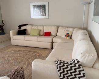Beautiful white sofa, all cushions and pillows have zippers so you can remove and wash.