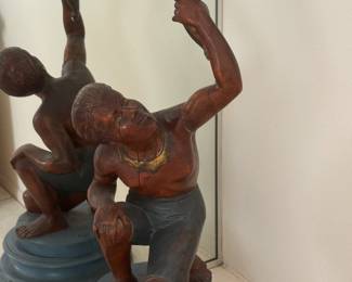UMM, not sure but he is carved from wood, very interesting piece