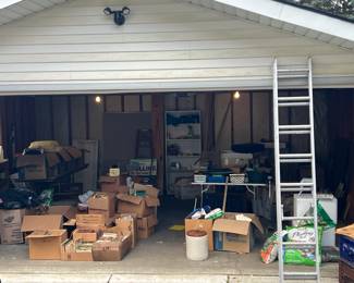 A garage full of garage stuff, as well as medical durable equipment, music, shelves, and more