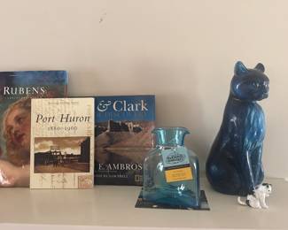 Unique pottery, glassware, and books