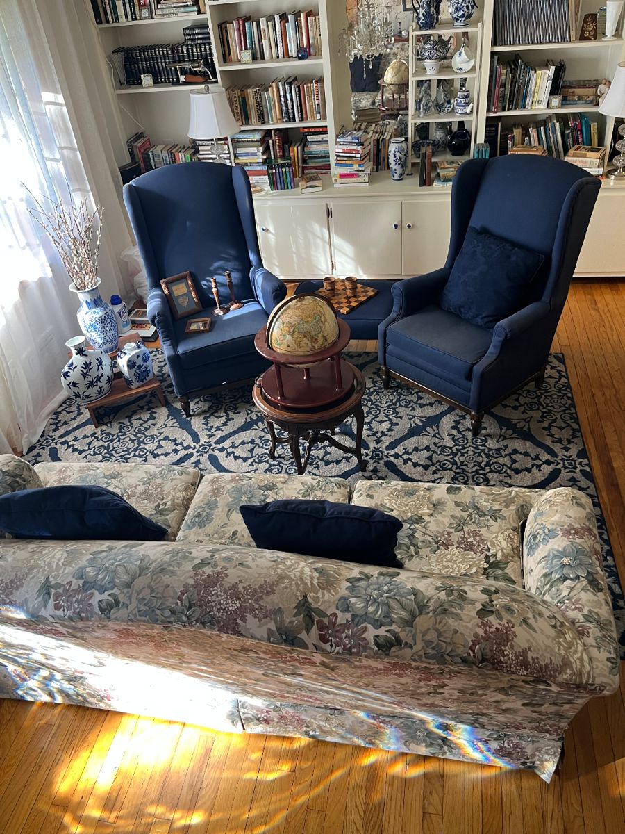 Blue wing back chairs, old world globe, blue and white decor