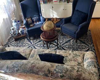 Blue wing back chairs, old world globe, blue and white decor