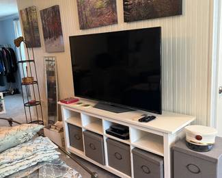 TV, TV stand, gray baskets