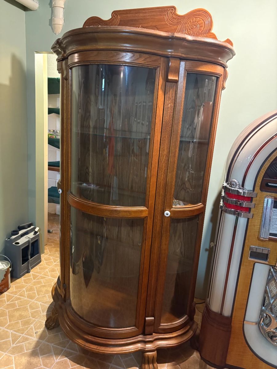 . . . nice claw-foot, curved-glass hutch
