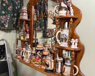 . . . nice display shelf loaded with a beer stein collection