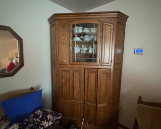 . . . corner cabinet filled with milk glass