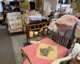 vinage quilts and many beautiful linens in our upstairs room