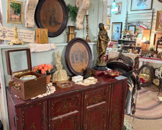 vintage cabinet, vintage framed art, wood shelves