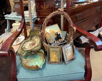 antique chair, framed portraits, decorative pottery