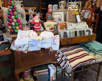 Christmas is mixed throughout the store, vintage afghans, quilts, mugs, linens