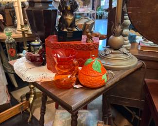 antique table, large brass candelstick, dog figurines
