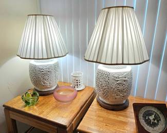 Pair of vintage reticulated Chinese Blanc de Chine porcelain table lamps with pleated shades.