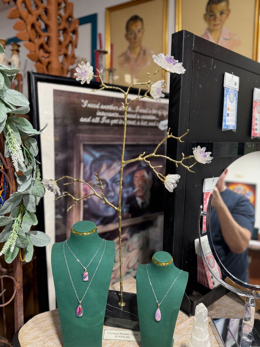 Gemstone Necklaces, Quartz, Amethyst and metal jewelry tree, vintage poster in frame.