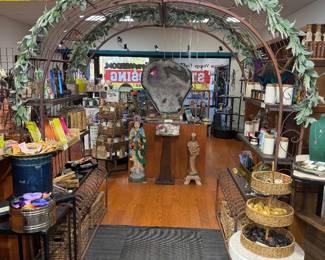 Unique one-of-a kind metal archway with wooden shelves.  Amethyst with metal stand