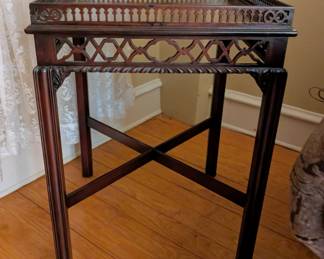 $200 Chippendale Mahogany Side Table
In the George II style, late 19th century
The square galleried top above fretwork apron, raised on lobe carved legs joined by X-stretcher. Top with some surface scratches.
20 x 20 x height: 29 in.